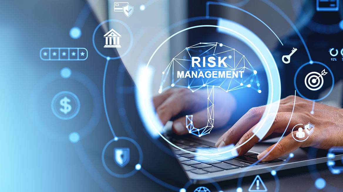 Risk Management hands typing on computer