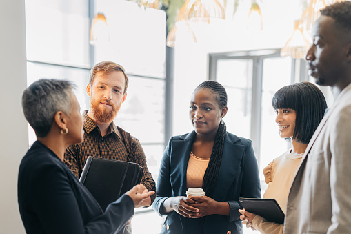Group of people having a discussion in a business setting